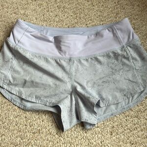 Like new!  Purple and black LR, 2.5 in sz 4 Lululemon speed up shorts